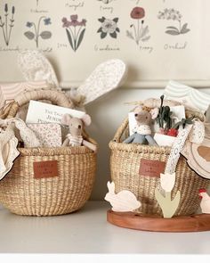 two baskets filled with stuffed animals sitting on top of a table