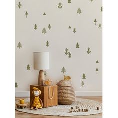 the wallpaper is decorated with pine trees and little monkeys on it's side