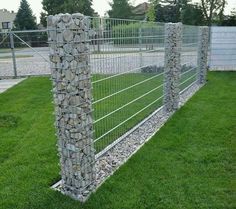 a fence made out of rocks and wire