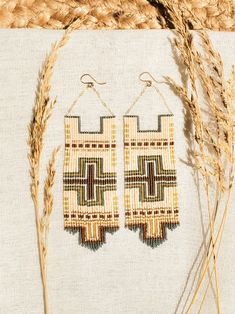 Experience the allure of a picturesque Southwest sunset with the Isla Beaded Earrings. Carefully handwoven using Delica seed beads, these earrings feature an intricate blend of warm terracotta, sandy beige, and golden hues reminiscent of adobe clay walls basked in the setting sun. With a perfect balance of elegance and rustic charm, these earrings add a touch of Southwestern elegance to any ensemble, making them an ideal choice for those seeking unique and artisanal jewelry. Handmade beaded earr Artisan Multicolor Beaded Earrings With Gold Beads, Delica Seed Bead Earrings, Beach Beaded Earrings With Colorful Beads, Colorful Beaded Brown Earrings For Beach, Brown Beaded Earrings For The Beach, Brown Handwoven Beaded Drop Earrings, Artisan Brown Earrings With Colorful Beads, Brown Woven Bohemian Jewelry, Bohemian Brown Woven Jewelry