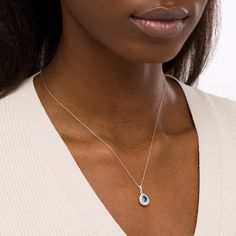 Increase the elegance factor of your dressy looks with this beautiful gemstone and diamond pendant. Fashioned in 14K white gold, this choice showcases a 6.0 x 4.0mm pear-shaped bright blue sapphire wrapped in a double frame of shimmering diamonds. Additional diamonds glisten along the linear bail to complete the design. Captivating with 3/8 ct. t.w. of diamonds and a brilliant buffed luster, this pendant suspends along an 18.0-inch rope chain that secures with a spring-ring clasp. Elegant Blue Diamond Pendant Necklace, Elegant Diamond Necklace With Birthstone, Elegant Blue Diamond Necklace For Wedding, Elegant Drop Shape Birthstone Necklace, Elegant Drop Birthstone Necklaces, Elegant Birthstone Drop Necklace, Elegant Drop Birthstone Necklace, White Gold Sapphire Teardrop Pendant Necklace, Timeless Sapphire Jewelry With Diamond Accents