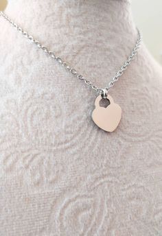 Handmade simple dainty necklace, made with small silver stainless steel heart pendant and dainty stainless steel cable chain. Stainless steel lobster claw closure. Stainless steel heart pendant size: ~15*17mm Stainless steel cable chain width : ~2.4mm ---> Similar necklace design available on the below link:  https://www.etsy.com/listing/1141396049/silver-heart-necklace-or-bracelet-small?click_key=8cba0b570ede54fef1c5ac068ffc0d0549adbcfc%3A1141396049&click_sum=dadddf07&ref=shop_home_active_27&cl Dainty Stainless Steel Heart Necklaces, Dainty Nickel-free Silver Heart Necklace, Dainty Heart-shaped Necklace For Gift, Minimalist Heart-shaped Metal Charm Necklace, Dainty Heart-shaped Stainless Steel Necklaces, Simple Heart Necklace, Small Heart Necklace, Necklace Everyday, Toggle Necklace