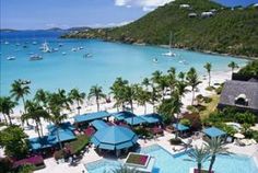 an aerial view of the resort and beach