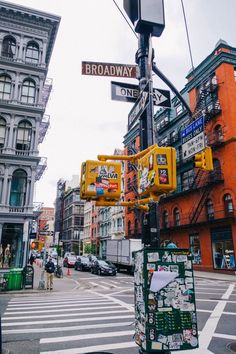 a street sign on the corner of broadway