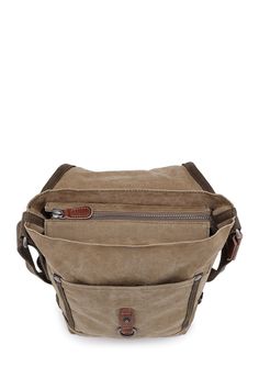 Featuring our military-Inspired Forest Crossbody Bag, designed and handcrafted from high-quality canvas, which allows you to securely carry all of your essentials at ease. . Foldover flap with interior zip closure. Adjustable crossbody strap. Interior features include 4 slip pockets and 1 zip pocket. Handcrafted. Approx. 10" x 8" x 3". Approx. 25" strap drop. Imported Exterior: cotton canvas, leather, recycled hardware, vegetable base dyes Lining: cotton Casual Crossbody Satchel For Everyday Carry, Khaki Duck Canvas Bag With Canvas Lining, Functional Khaki Canvas Bag For Everyday Use, Functional Khaki Canvas Bag, Outdoor Canvas Shoulder Bag With Cell Phone Pocket, Khaki Canvas Bag With Zipper Pocket For Everyday Use, Functional Khaki Bags With Canvas Lining, Canvas Shoulder Bag With Cell Phone Pocket For Travel, Functional Khaki Bag With Canvas Lining