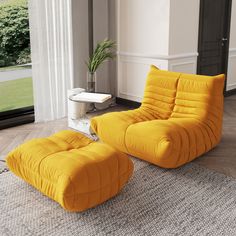 an orange chair and ottoman in a living room with a door leading to the outside