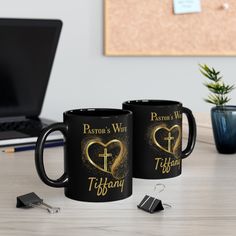 two black coffee mugs with the words pastor's wife and titan on them