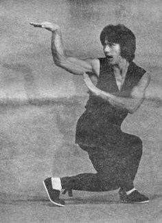 an old black and white photo of a man playing tennis