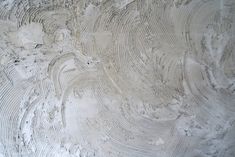 a close up view of the surface of a concrete slab with white paint on it