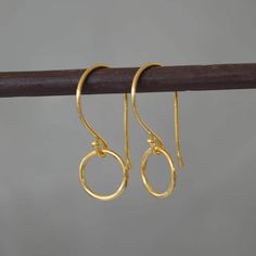 "Beautiful minimalist 24k gold vermeil circle earrings. Vermeil is a thick coat of 18 or 24 karat gold on solid sterling silver. These earrings would make a perfect gift for any occasion. Total length: 2.5 cm (0.9\") Circle diameter: 1 cm (0.3\") They will come in a beautiful gift box. Matching necklace available: www.etsy.com/uk/listing/834068362/minimalist-24k-gold-vermeil-circle?ref=shop_home_active_13&pro=1&frs=1  * CHECK OUT MORE JEWELLERY *   www.etsy.com/shop/kailajewellery" Simple Gold Round Earrings, Gold Minimalist Round Pendant Earrings, Dainty Yellow Gold Circular Earrings, Gold Circle Earrings In Sterling Silver, Gold Sterling Silver Circle Earrings, Gold Minimalist Open Circle Earrings, Minimalist Gold Open Circle Earrings, Everyday Gold Open Circle Earrings, Minimalist Gold-plated Circle Earrings