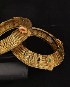 Simply a mark of royalty and elegance!! Handcrafted in brass with gold plating and fine quality Kundan stones. Set of 2 For wrist Size 2.4 Inner Diameter: 2.25 inches Not Openable The bangles are the same as shown in the pictures. We have only one piece in this color and design, hence you get what you see in the pictures. Gold Meenakari Bangle For Marriage, Heavy Gold Bracelets For Marriage, Gold Heavy Bracelets For Weddings, Gold Temple Jewelry Bangle For Marriage, Traditional Gold Bangle For Marriage, Gold Temple Jewelry Bracelet For Marriage, Gold Bracelets With Intricate Design For Marriage, Gold Jeweled Bracelets For Celebration, Gold Bracelets With Detailed Design For Marriage