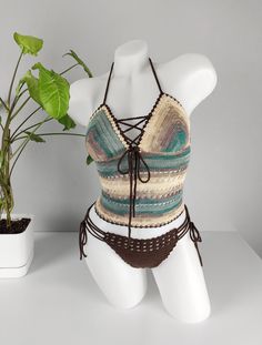 🏖️ Dive into summer with our exquisitely handcrafted crochet bikini set, made from high-quality acrylic yarn. This unique, bohemian-style swimwear offers the perfect blend of comfort and style, making it ideal for beach outings, pool parties, and tropical vacations. Each piece is carefully designed to provide a flattering fit, ensuring you feel confident and chic wherever you go. * Material: 100% soft acrylic yarn for durability and comfort. * Design: Elegant crochet pattern with adjustable str Fitted Bohemian Halter Top For Poolside, Crochet Swimwear For Poolside Vacation, Bohemian Fitted Swimwear For Beach Cover-up, Hippie Fitted Swimwear For The Beach, Fitted Hippie Swimwear For Beach, Hippie Style Fitted Beach Swimwear, Bohemian Fitted Halter Top For Sunbathing, Fitted Bohemian Halter Top For Sunbathing, Brown Crochet Top For Summer Vacation