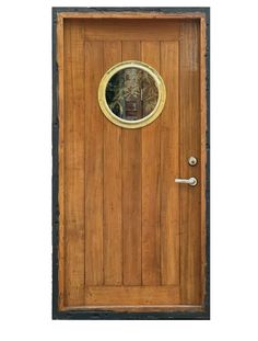 a wooden door with a round window on it