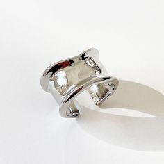 Experience the Modernism Concave Silver Ring Wide Band - a striking and lighthearted accessory that doesn't take itself too seriously! This charming and edgy design will add a touch of playfulness to any ensemble. Don't pass up on this silver band that is guaranteed to catch eyes. Band width: approx. 15mm Size: US7, open ring and slightly adjustable S925 silver To complete the look, check out our Modernism Concave Stud Earrings with gold and silver options available. Contour Ring, Simple Pearl Necklace, Edgy Design, Collar Chain, Simple Necklace, Open Ring, Wide Bands, Modernism, Silver Band