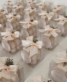 many small boxes with bows on them are lined up in the shape of cubes