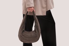 Brown Suede Hobo Bag - The Perfect Blend of Style and Comfort Elevate your fashion game with our exquisite Brown Suede Hobo Bag. Crafted from high-quality suede, this Soft Leather Bag combines luxury with functionality, making it an ideal addition to any wardrobe. Product Features: Suede Hobo Bag: Made from premium suede, this bag offers a soft, velvety texture that's both stylish and durable. Rounded Design Bag: The unique rounded shape adds a contemporary touch to a classic silhouette, making Suede Hobo Bag, Suede Tote Bag, Suede Purse, Soft Leather Bag, Suede Tote, Design Bag, Suede Handbags, Hobo Style, Brown Leather Bag