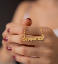 "Our 14K Gold name necklaces do not turn yellow and have a colorfast structure. In this way, you can use your name necklace for many years. The 14K Gold Name Necklace is an essential accessory for a woman or a girl. ❤️ It would be an amazing gift for Valentines Day, Anniversary, Birthdays, Christmas, Mother's Day, Women's Day. ❤️Gold Name Necklace is sent with a special packaging. I have prepared a special wooden box for you. You can share it with your loved ones as a personalized gift. ❤️You can ask us for help when ordering your Nameplated necklace. We can send you a design of the necklaces with fonts beforehand. FEATURES - Material: 14K Gold, Rose Gold, White Gold - Letter height is 8.5mm to 9mm. (1/3 inches) - Color Options: Gold, Rose, White ❤️Production Techniques: Handmade and Laser Customized Yellow Gold Necklace For Anniversary, Customized Nameplate Necklaces For Anniversary, Name Pendant Necklaces For Anniversary, Name Pendant Necklace For Anniversary, Custom Name Necklace In Yellow Gold For Anniversary, Custom Yellow Gold Name Necklace For Anniversary, Customized Gold Name Necklace With Round Pendant, Custom Name Necklace With Round Pendant For Anniversary, Customized Gold Necklace For Anniversary