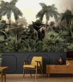 a living room filled with furniture next to a wall covered in plants and palm trees