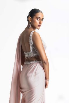 Elevate your style with our rose to blush ombre dyed satin draped sari. The net blouse and satin palla are adorned with tonal sequins, beadwork, and crystals, making it a dazzling choice for any special occasion. Make a graceful entrance and leave a lasting impression in this exquisite ensemble. Placement Embroidery, Net Blouse, Draped Saree, Net Blouses, Padded Blouse, Drape Saree, Satin Color, Pink Ombre, Cut Work