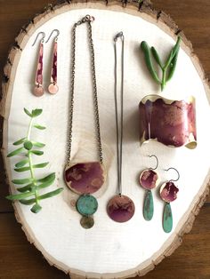 "Oxidized brass metal with shades of pink and green verdigris. Hang from oxidized sterling silver ear wires. Measure ~ 1\"x2.5\" **shades of color will vary due to the patina process. The product pictured is a sample of what you will receive.** Handmade in the USA ssd jewelry ©️ 2018" Handmade Artsy Bronze Jewelry, Artsy Handmade Bronze Jewelry, Copper Dangle Jewelry With Patina, Copper Dangle Earrings With Patina, Artsy Electroformed Jewelry For Gifts, Earthy Nickel-free Copper Jewelry, Handmade Brass Artsy Jewelry, Handmade Artsy Brass Jewelry, Artistic Copper Jewelry