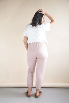 The Plateau Joggers are an elevated take on classic knit jogging pants. With a high rise, unique wrap-around pockets and a comfy elastic waist, they are ideal loungewear at home or on the street. View A is a relaxed fitting pant with an optional drawstring waist and two choices of ankle finish: a fabric cuff or gathered elastic hem. View B is a pair of shorts with a gently scalloped hem. Optional back pockets can be added to either view. Sizes: 0 to 20 New, uncut, paper pattern Cotton Joggers For Loungewear Sportswear, Sportswear Sweats With Elastic Waistband For Lounging, Super Soft Comfortable Bottoms For Leisure, Comfortable Super Soft Bottoms For Leisure, Cozy Fit Sweatpants With Elastic Cuffs For Loungewear, Cozy Activewear With Pockets For Lounging, Cozy Casual Activewear With Pockets, Solid Color Sweats With Elastic Waistband For Loungewear, Relaxed Sweatpants With Elastic Cuffs For Loungewear