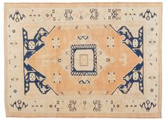 an old rug with blue and white designs on it's edges, in the shape of a square