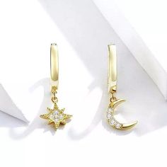 This pair of asymmetric mismatched moon and stars dainty huggie hoop earrings are just simple, delicate and elegant. Materials is solid 925 sterling silver, dipped in a 18k gold plate to achieve the shiny gold luxury color. The inner hoop circle has an 8 mm diameter, can be wear at the first and second ear lope holes. Hoop design allow you to sleep wearing the earrings without getting uncomfortable with the post. The based metal of these moon star earrings is solid 925 sterling silver with a 18k Moon And Star Earrings, Star And Moon, Gold Luxury, Small Hoop Earrings, Hoop Design, Gold Overlay, Gold Moon, Moon And Star, Star Jewelry