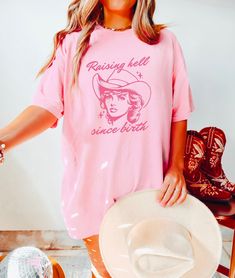 Raising Hell Since Birth Tee Comfort Colors® Baddie Aesthetic Retro Cowgirl Shirt 90s Country Music Western Graphic Tee Nashville Girls Trip Getting Ready Western Bride Tee Nash Bash  Shop all The June Kind - https://www.etsy.com/ca/shop/TheJuneKind? * Unique Hand drawn Graphics * Women Owned Small Business * Made to Order, especially for You ----------  Please read before placing your order -------------- 1. This apparel is GENDER NEUTRAL / UNISEX relaxed fit, that is flattering for all bodies. 90s Style Short Sleeve Top For Concert, Spring Concert Tops With Front Print, Spring Concert Top With Front Print, 90s Short Sleeve Top For Concert, Summer Concert Top With Front Print, 90s Style Summer Shirt With Funny Print, Summer Band Merch Tops Relaxed Fit, Spring Concert Top With Text Print, Spring Concert Short Sleeve Tops