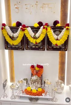 the altar is decorated with flowers, candles and other things to decorate for someone's special occasion