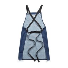 a denim apron with black straps