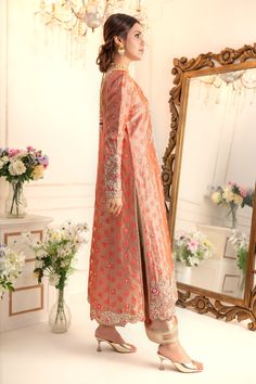 Elevate your style quotient this wedding season, with this romantic multi- paneled A-line shirt, beautifully adorned with botanical embroidery with dabka, pearls, kundan, glistening sequins, delicate beads and resham work. This relaxed fit shirt is paired with gota detailed izaar and two tone katan silk jacquard dupatta adorned with gota and sequin embellishments to complete the festive look of this outfit Shirt Fabric: Pure jacquard Soft tissueShirt Length: 48” (customisable, mention in order n Anarkali Dress With Dupatta And Front Open Style, Designer Resham Embroidered Front-open Anarkali Set, Traditional Front Open Sharara With Resham Embroidery, Designer Wear Front Open Sharara For Eid, Designer Wear Front Open Salwar Kameez With Zari Work, Front Open Sharara With Dupatta For Wedding, Designer Wear Front Open Sharara, Semi-stitched, Reception Sherwani With Dupatta In Georgette, Georgette Sherwani With Dupatta For Reception