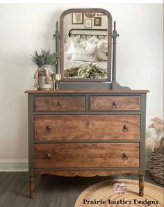 a dresser with a mirror on top of it