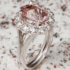 3.70 Carats Exquisite Natural Morganite and Diamond 14K Solid White Gold Ring Suggested Replacement Value: 6,500.00 Total Natural Morganite Weight: Approx. 2.35 Carats Morganite Measures: Approx. 10.00 x 8.00mm Natural Round Diamonds Weight: Approx. 1.20 Carats (color G-H / Clarity SI1-SI2) Ring total weight: 6 grams Disclaimer: all weights, measurements and colors are approximate and may vary slightly from the listed dimensions or as seen in the image. All pictures are magnified to show the sma Exquisite Platinum Gemstones, Luxury Gia Certified Gemstones, Formal Morganite Diamond Ring With Brilliant Cut, Formal Pink Cluster Ring With Brilliant Cut, Classic Morganite Diamond Ring For Formal Occasions, Classic Pink Cluster Ring For Formal Occasions, Luxury Cluster Ring With Round Cut Gemstone, Formal Morganite Ring With Brilliant Cut, Exquisite Round Gemstones With Halo Setting