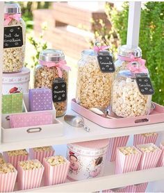 a table filled with lots of different types of popcorn