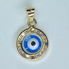 Solid 14k Gold Round Evil Eye Amulet Pendant Brand New- Never Worn Perfect Every Day Piece For Everyone - Women & Kids Fashionable & Trendy If You Have Any Questions Please Let Me Know! Spiritual 14k Gold Jewelry Stamped 14k, 14k Gold Spiritual Round Pendant Jewelry, Spiritual 14k Gold Round Pendant Jewelry, Spiritual 14k Gold Round Pendant, Elegant Yellow Gold Jewelry With Cubic Zirconia Charms, Spiritual 14k Stamped Pendant Jewelry, Symbolic Diamond Charms Jewelry, Symbolic Round Cubic Zirconia Jewelry, Stamped 14k Amulet Pendant