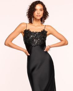 Make a statement at your next black tie affair in the Elora, an alluring silky satin slip dress with a dramatic touch. Adorned with laser-cut faux leather floral embellishments that enhance the bodice and highlight your frame, embrace your elegance when you step out in the Elora. Size & Fit – Fits true to size, tak Glamorous Silk Slip Dress With Spaghetti Straps, Elegant Embellished Slip Dress For Party, Elegant Summer Slip Dress With Sheer Bodice, Chic Party Dresses With Satin Trim, Luxury Fitted Slip Dress For Party, Dressy Satin Slip Dress For Party, Glamorous Silk Satin Dress With Spaghetti Straps, Glamorous Silk Sleeveless Slip Dress, Glamorous Satin Finish Slip Dress For Formal Occasions