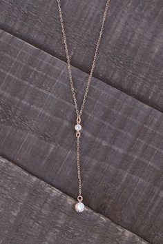 Our Rose Gold Y Necklace is SO exquisite. The delicate rose gold filled chain is so sparkly & perfect for all those rose gold lovers out there!----------------------FEATURES◊ Cubic zirconia charms set in rose gold filled bezels◊ Rose gold filled cable chain ◊ Necklace length is shown at 18" around the neck, plus 2.5" for the drop. ◊ All necklace findings are 100% rose gold-filled (charms, chain, clasp, & end tags) ◊ This is a VERY high quality piece. Makes a wonderful gift for your loved Adjustable Rose Gold Dainty Lariat Necklace, Dainty Adjustable Rose Gold Lariat Necklace, Adjustable Dainty Rose Gold Lariat Necklace, Delicate Rose Gold Lariat Necklace Gift, Dainty Rose Gold Lariat Necklace, Rose Gold Lariat Necklace With Delicate Chain, Rose Gold Lariat Necklace With Adjustable Chain, Elegant Rose Gold Lariat Necklace With Clavicle Chain, Delicate Rose Gold Lariat Necklace With Clavicle Chain