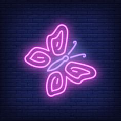 a neon butterfly on a brick wall