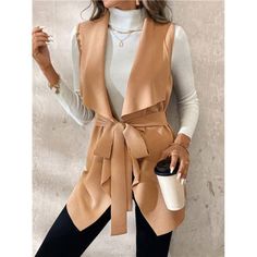 -Item Id 39056209 -Details: Belted -Neckline: Waterfall -Style: Casual -Type: Vest -Hem Shaped: Asymmetrical -Color: Khaki -Pattern Type: Plain -Sleeve Length: Sleeveless -Fit Type: Regular Fit -Length: Regular -Material: Knitted Fabric -Composition: 95% Polyester, 5% Elastane -Care Instructions: Hand Wash,Do Not Dry Clean -Sheer: No -Fabric: Medium Stretch -Body: Unlined -Pockets: No -Temperature: Spring/Fall (18-25/63-77) **Open To Offers!!!** **Bundle To Save More** **30% Off Bundles Of 2 Or Chic Brown Winter Vest, Solid Vest For Layering In Fall, Fall Vest With Pockets, Chic Brown V-neck Outerwear, Chic V-neck Outerwear For Winter, Chic V-neck Winter Outerwear, Beige V-neck Spring Outerwear, Trendy Winter Vest For Workwear, Beige V-neck Outerwear For Office