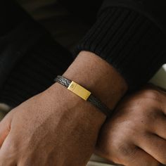 The Grady is a handmade bracelet featuring a slim cowhide leather strap. The design is comfortable, minimalist, straightforward, and stylishly refined.- WIDTH: 8 mm- MATERIAL TYPE: 100% genuine pebbled cowhide leather- CLASP COLOR: Brushed gold- CLASP MATERIAL: 316L stainless steel, 18K gold PVD plated- CLASP TYPE: Magnetic Golf Bracelet, Gold Bracelet For Men, Gold Armband, Mens Gold Bracelets, Bracelet Men, Jewelry For Men, Mens Leather Bracelet, Bracelet For Men, Black Edition