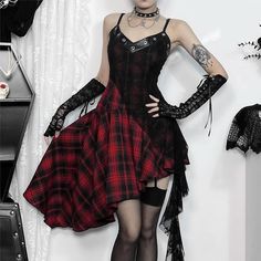 Explore our Gothic Punk Plaid Lace Asymmetrical Dress for a unique style statement. Featuring eyelet leather v-neck, spaghetti straps, and lace overlay, this dress exudes edgy elegance. Stand out with the vibrant red plaid pattern and high-low hem. Embrace your individuality with this must-have piece. Eyelet leather v-neck Spaghetti straps Lace overlay Vibrant red plaid pattern High-low hem Red Gothic Spring Dresses, Red Fitted Gothic Mini Dress, Gothic Mini Dress With Straps, Gothic Red Dress With Lace Trim, Red Plaid Alternative Dress, Vintage Sundress, Punk Plaid, Alternative Dress, Edgy Elegance