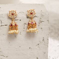 Description This timeless jhumki earring is perfectly crafted with polki stones on a gold-plated setting and finished with precious stones. An elegant wardrobe essential, these jhumki earrings will be your favorite. Style with the complementary accessories from the Vihara family for a grand look. This is the perfect choice for festival events and weddings. Product Information Materials used: 925 Silver with 1.0-microns Antique Gold Plating Stones: Semi precious stones Length: 3.5 cm Findings: Ho Luxury Fusion Style Jhumkas With Stone Work, Navratri Latkans Jhumka Drop Earrings, Gold Plated Temple Jewelry Danglers For Diwali, Temple Jewelry Style Jhumkas For Navratri, Temple Jewelry Jhumkas For Navratri, Diwali Temple Jewelry Gold-plated Danglers, Navratri Jhumkas With Latkans, Temple Style Drop Jhumkas For Navratri, Temple Style Jhumkas For Navratri