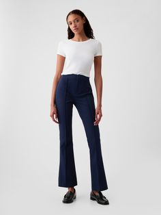 Soft cotton-spandex stretchy dress pants.  Snap button closure, zip fly.  Pintuck pleat at front.  Back welt pockets.  Our High Rise Jean has an 11" 28 cm) rise. ​ Slim through the hip and thigh, flares from knee to leg opening.  Model is approx.  5’10” wearing Best Work Pants, Stretchy Dress Pants, Buisness Casual, Work Pants Women, Navy Blue Pants, Business Pants, Blue Trousers, Stretchy Pants, Stretchy Dress