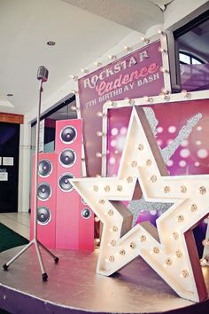 there is a large star on top of a table with speakers in front of it