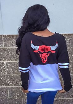 Chicago Bulls Womens Black Athletic LS Tee Black Sublimation Print Tops For Game Day, Black Screen Print Top For Fan Apparel, Black Screen Print Tops For Fans, Black Fan Apparel Top With Screen Print, Black Printed Tops For Fan Merchandise, Trendy Long Sleeve Tops For Game Day, Black Fan Apparel Top With Front Print, Long Sleeve Screen Print Fan Apparel Top, Fall Season Black Top For Sports Fans