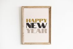 a framed poster with the words happy new year on it