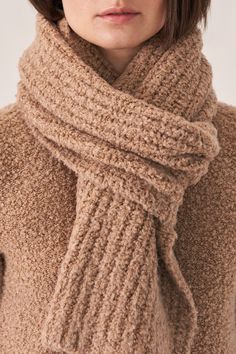 Teddy textured scarf. Wrap around your neck for full coverage and extra warmth. Teddy texture adds fullness to scarf. Wear with teddy beanie hat. ABLQ3F9 - 77% virgin wool / 19% silk / 4% polyamide- Casual comfort- Luxury at a great price- Length - 72 inches- Width - 13 1/2 inches Cozy Soft Wool Knit Scarves, Cozy Beige Soft Knit Scarves, Knit Scarves For Cold Weather, Cozy Beige Soft Knit Scarf, Cozy Beige Scarves For Cold Weather, Cozy Knit Scarves For Winter, Cozy Scarves For Cold Weather, Cozy Wool Scarves For Winter, Chunky Knit Scarves For Winter Cold Weather