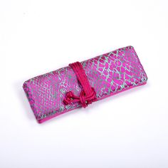 "Provide an easy way to organize your jewelry items for travel or at home. 2 zippered pockets and 1 large open pocket, one ring holder. Tie with drawstrings. Approx. 8\"L x 3\" W x 1\" when tied or 11.5\" L x 8\" W flat." Pink Portable Organizer For Personal Use, Pink Portable Rectangular Organizers, Purple Portable Pencil Case For Gift, Foldable Rectangular Pencil Case For Travel, Pink Rectangular Pouch As Gift, Pink Rectangular Pouch For Gift, Handmade Rectangular Travel Cosmetic Bag, Portable Pouch Pencil Case As Gift, Rectangular Travel Pouch With Case