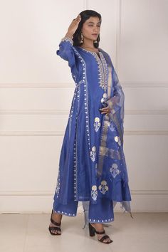 Sky blue chanderi anarkali featuring all over block printed mughal floral motifs highlighted with dori embroidery. Comes with palazzo and dupatta.
Components: 3
Pattern: Block Print, Embroidered
Type Of Work: Floral, Dori
Neckline: Notched
Sleeve Type: Three quarter
Fabric: Anarkali: Chanderi, Palazzo: Cotton, Dupatta: Organza 
Color: Sky Blue
Other Details: 
Length:
Anarkali:  48 Inches
Palazzo: 38 Inches
Dupatta: 2.5 Mtr 
Occasion: Sangeet,Mehendi and Haldi - Aza Fashions Sky Blue Anarkali, Mughal Floral Motifs, Chanderi Anarkali, Dori Embroidery, Blue Anarkali, Palazzo Set, Cotton Dupatta, Floral Motifs, Set For Women