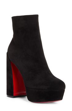 Pre-order this style today! Add to Shopping Bag to view approximate ship date. You'll be charged only when your item ships.A chunkier-than-most platform and lofty sculptural heel provide statement-making lift for this sleek ankle boot crafted of supple calfskin suede. Christian Louboutin's iconic red sole—born from a fateful brush with nail lacquer—adds a burst of signature color to every step. 5" (127mm) heel; 1 1/2" platform (size 38.5) 5" shaft Side zip closure Wipe with a soft, dry cloth and Christian Louboutin Platform Heels, Modern High Ankle Suede Heeled Boots, Chic High Shaft Platform Boots With Reinforced Heel, Chic Platform Boots With Reinforced Heel And High Shaft, Suede High Ankle Heeled Boots For Evening, Evening High Ankle Suede Heeled Boots, High Ankle Suede Heeled Boots For Evening, High Ankle Platform Boots For Formal Occasions, Suede High Ankle Evening Boots